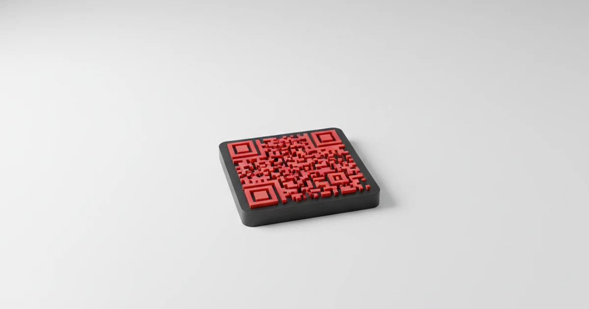 Un llavero impreso en 3D con un código QR en relieve