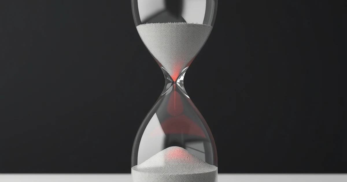 Reloj de arena en el que solo una parte de la arena cae iluminada en rojo